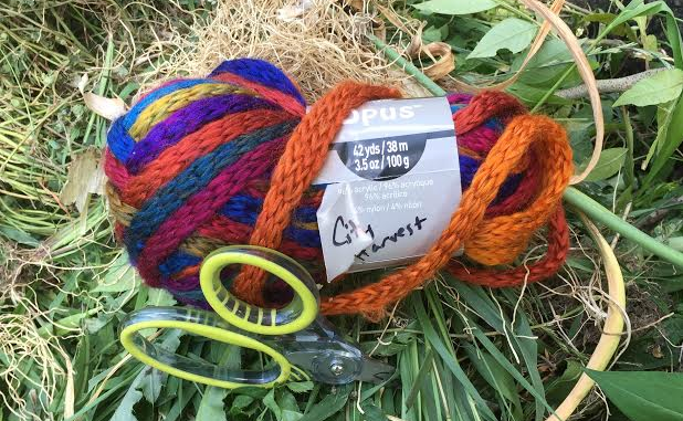 photo: skein of multicolored yarn with scissors