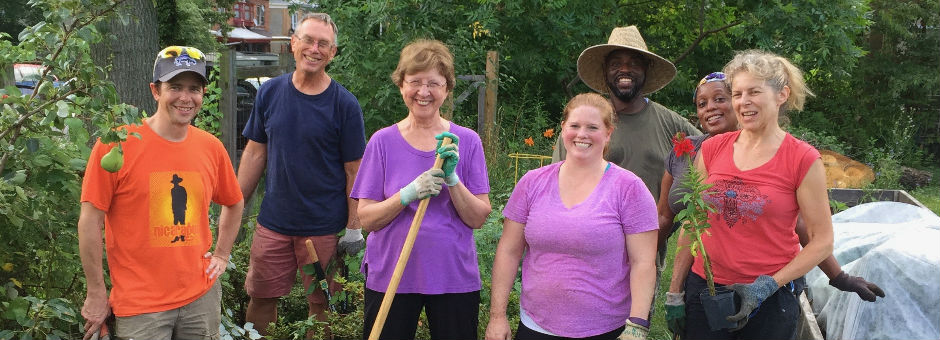 photo: group of gardeners posing with tools