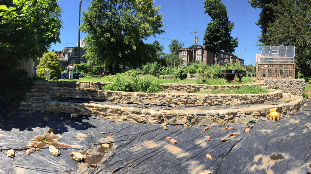 photo: amphitheater in summer with black plastic on ground