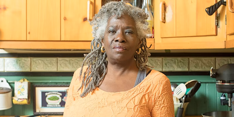 photo: dreadlocked woman in kitchen