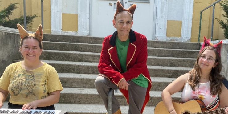 Photo of musical trio wearing fox ears