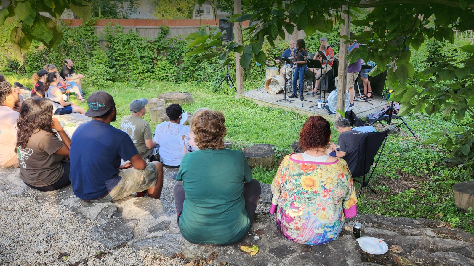 photo of people watching concert in outdoor amphitheater