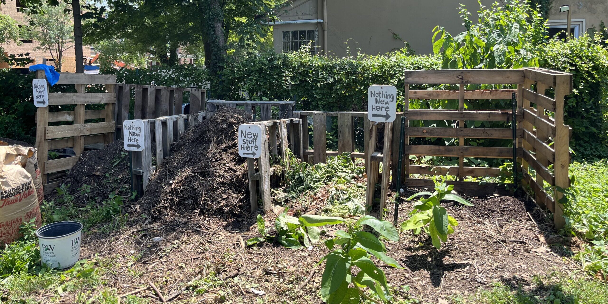 photo of compost bins made of shipping pallets
