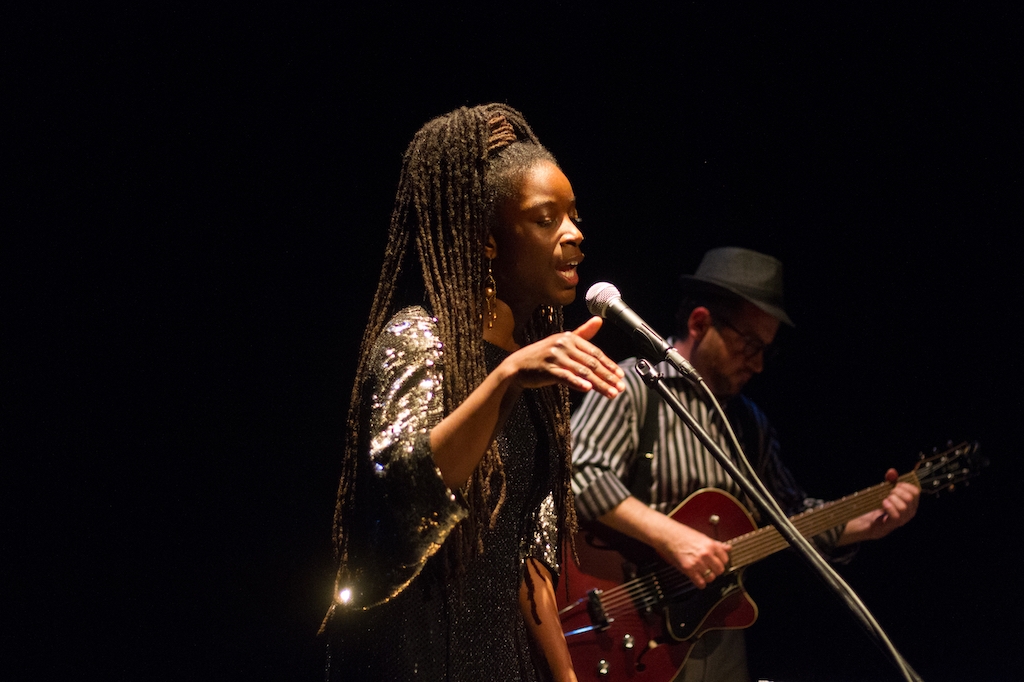 Photo: female singer with dredlocks, male guitarist with fedora